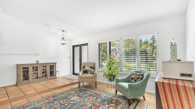 living area with vaulted ceiling and light tile patterned flooring