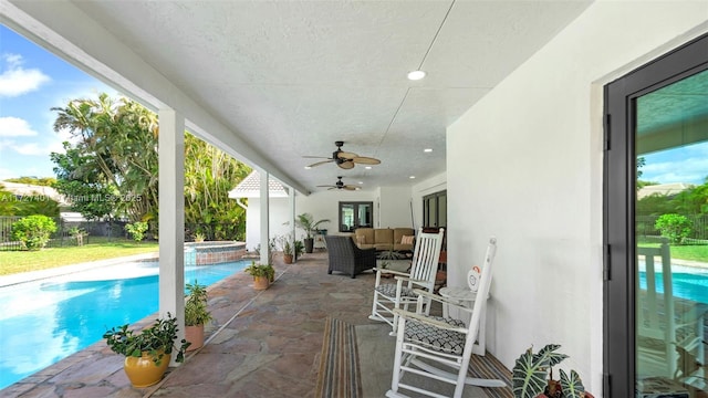 view of swimming pool featuring an in ground hot tub, an outdoor hangout area, ceiling fan, and a patio