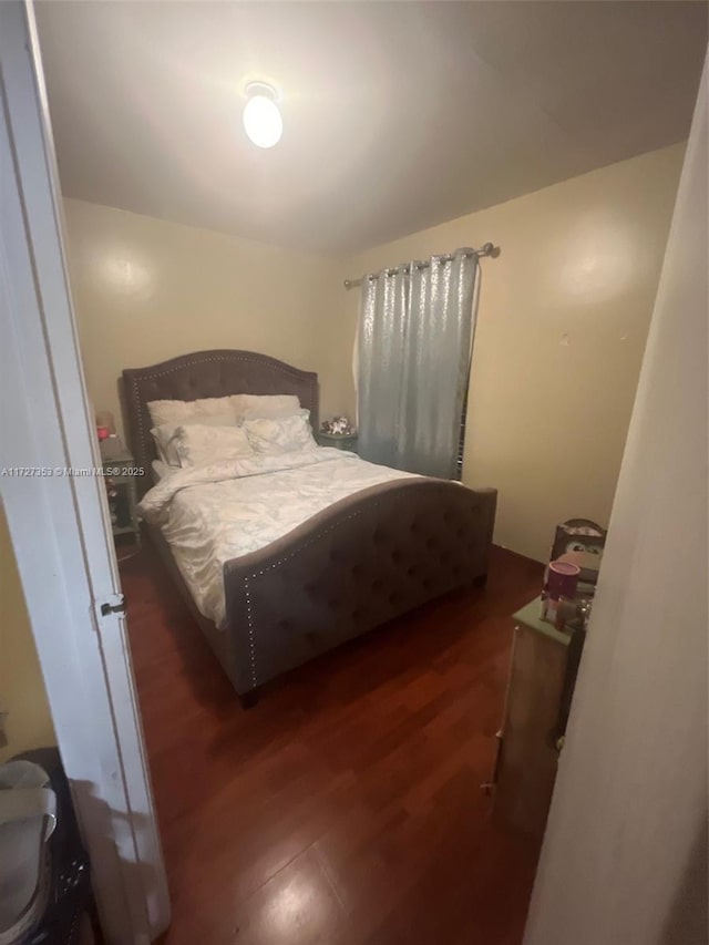 bedroom featuring dark hardwood / wood-style flooring