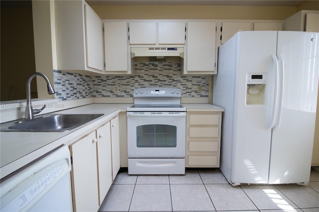 kitchen featuring white cabinetry, backsplash, white appliances, light tile patterned flooring, and sink