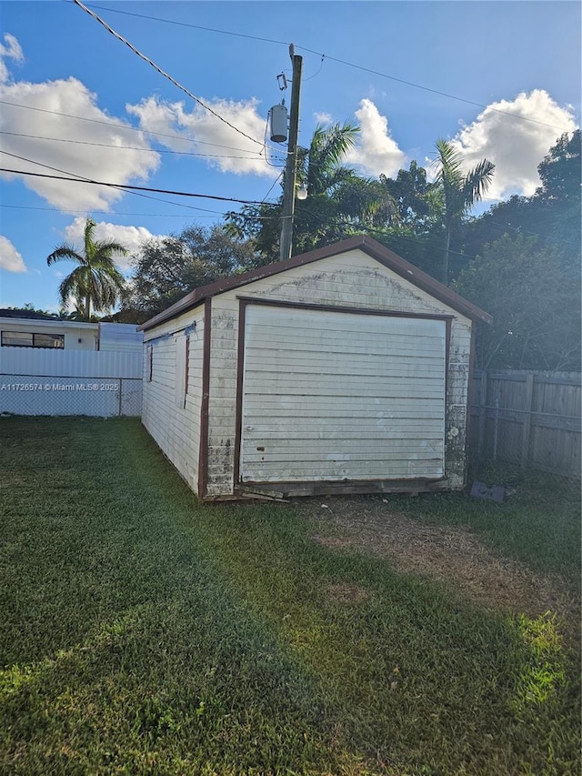 garage with a yard