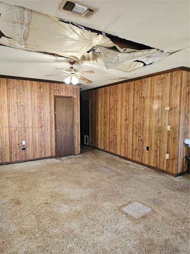 basement featuring wooden walls