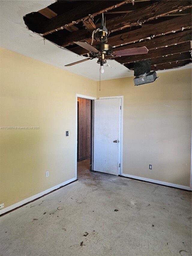 interior space with ceiling fan and a closet