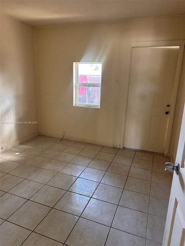 empty room featuring light tile patterned flooring