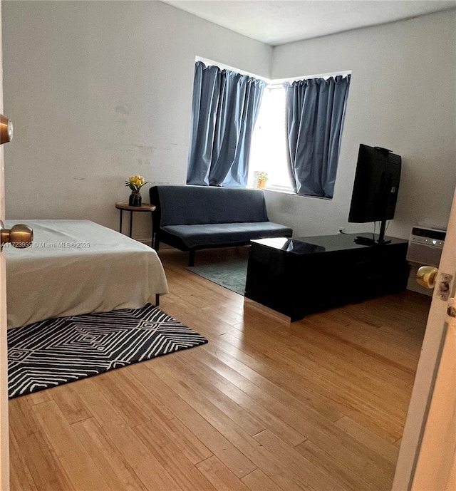 bedroom with light hardwood / wood-style flooring