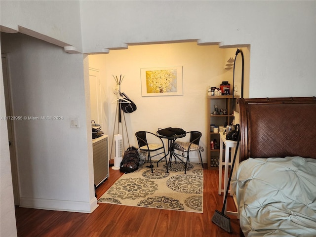 bedroom featuring dark hardwood / wood-style flooring