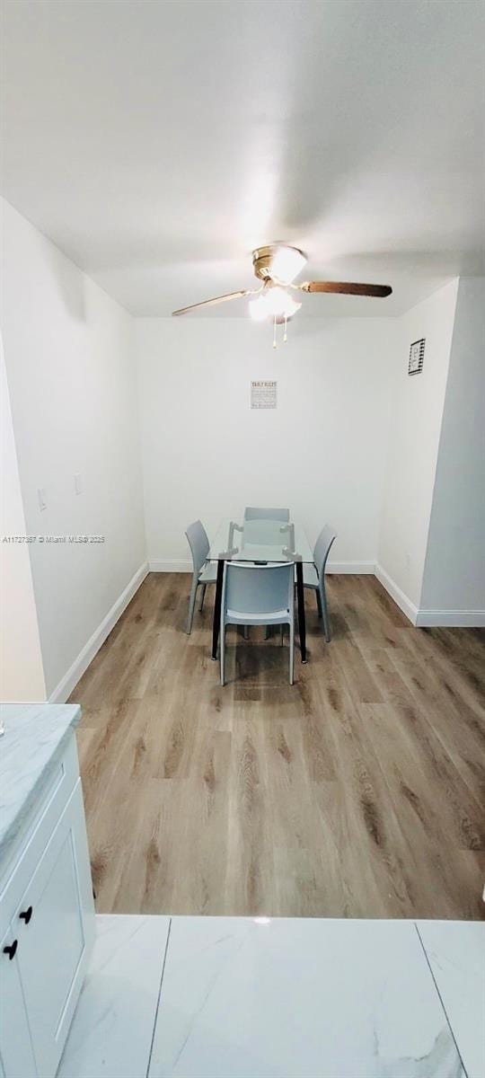 dining area with light wood-type flooring