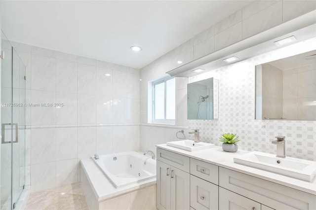 bathroom with vanity, tile walls, and plus walk in shower