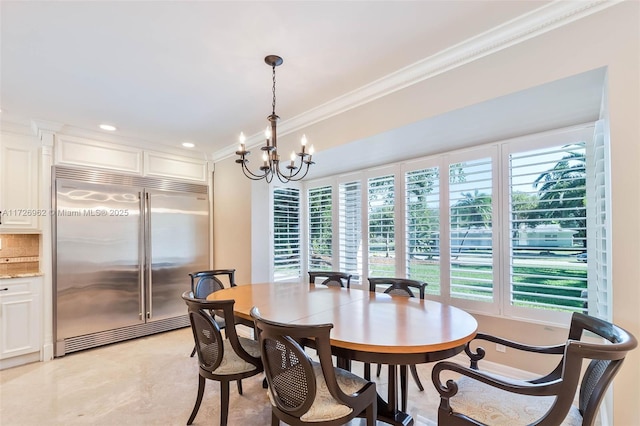 dining space featuring an inviting chandelier and ornamental molding