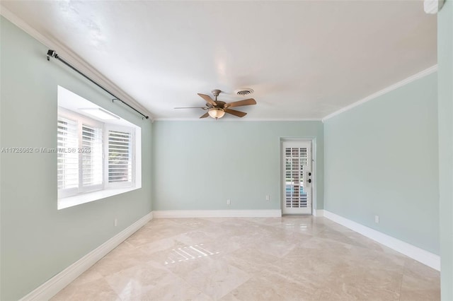 unfurnished room featuring ceiling fan and crown molding