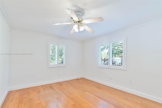 spare room with ceiling fan, a wealth of natural light, crown molding, and light hardwood / wood-style floors