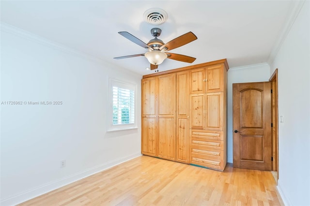 unfurnished bedroom featuring ceiling fan, ornamental molding, and light hardwood / wood-style floors