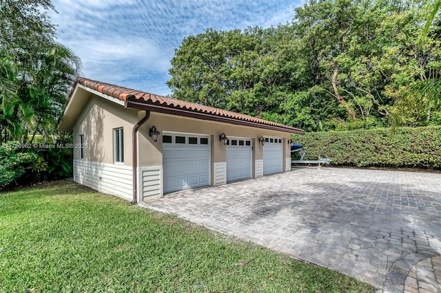 garage with a lawn