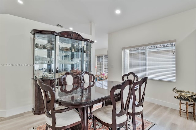 dining area featuring light wood-type flooring