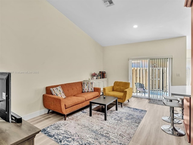 living room with light hardwood / wood-style floors