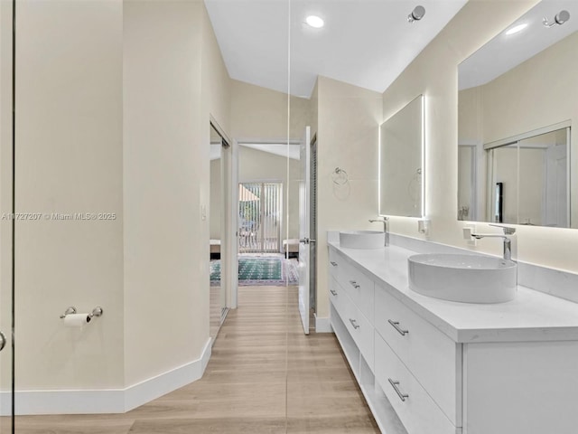 bathroom featuring hardwood / wood-style flooring and vanity