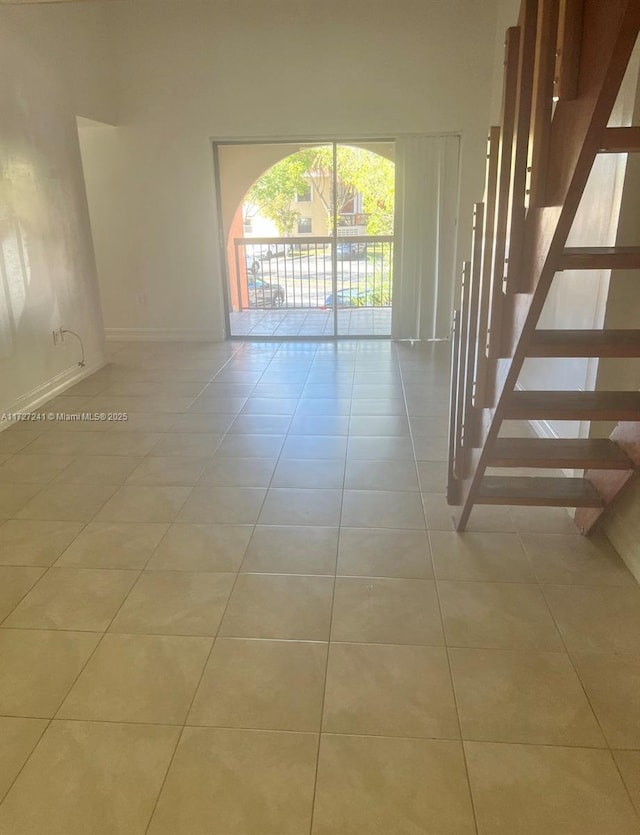 spare room with light tile patterned flooring