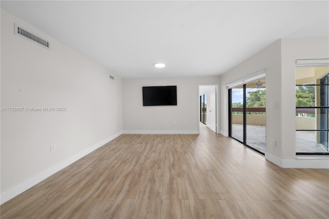 unfurnished living room featuring light hardwood / wood-style floors