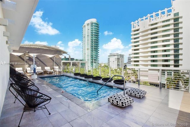 view of swimming pool with a pergola and a patio area