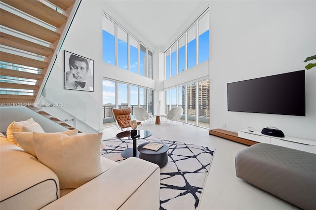 living room with a towering ceiling