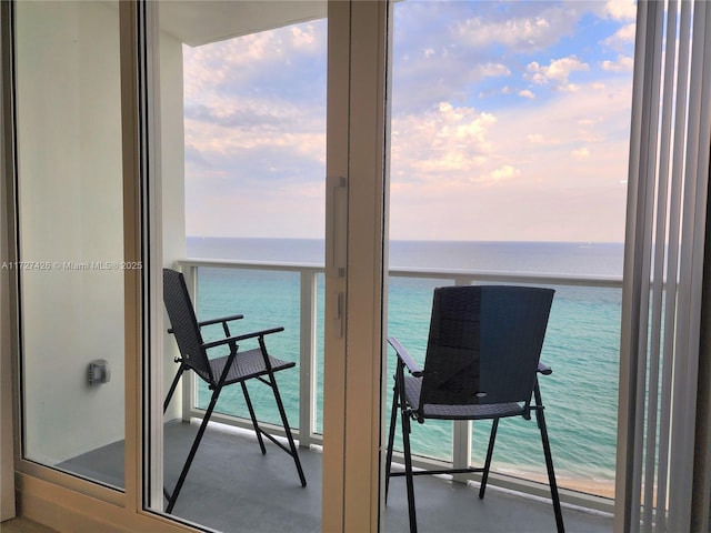 balcony featuring a water view