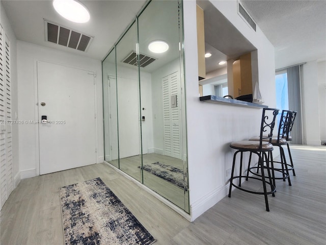 bathroom with hardwood / wood-style flooring