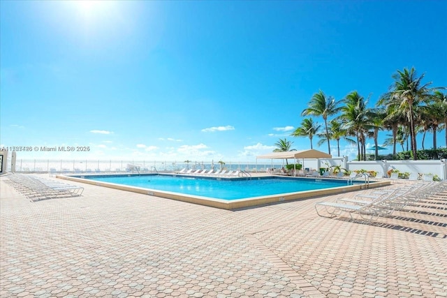 view of swimming pool with a patio area