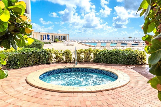 view of pool with a community hot tub