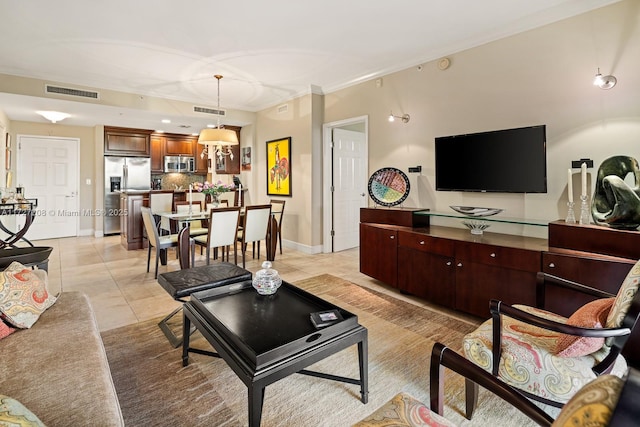 tiled living room featuring crown molding