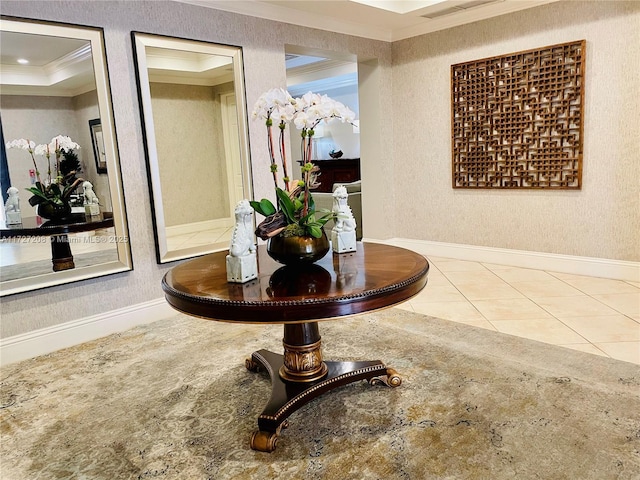 hall with tile patterned floors and crown molding