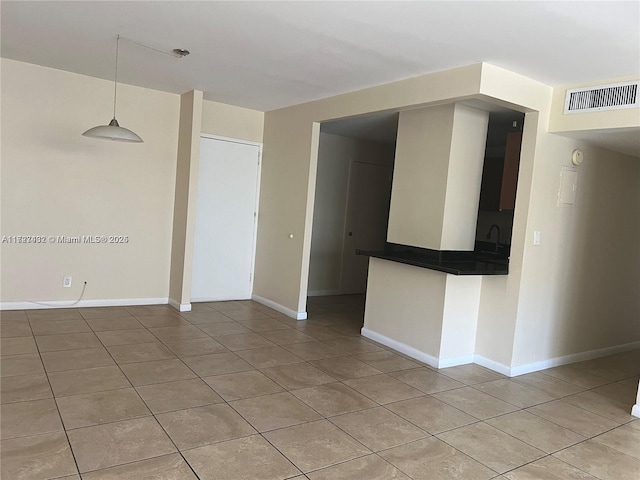 empty room featuring light tile patterned floors