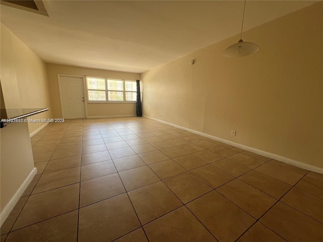 spare room featuring tile patterned floors