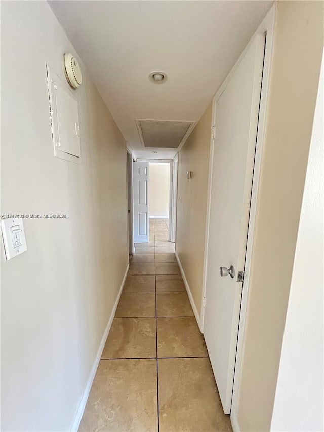 corridor with light tile patterned floors