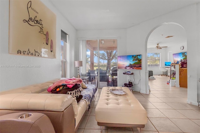 living room featuring ceiling fan and light tile patterned flooring