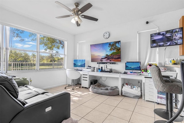 tiled office featuring ceiling fan