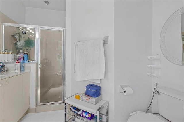 bathroom featuring walk in shower, tile patterned floors, and toilet