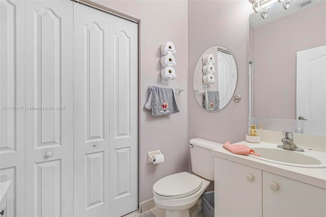 bathroom with vanity and toilet