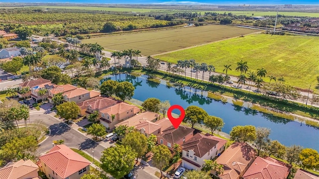 bird's eye view with a residential view and a water view