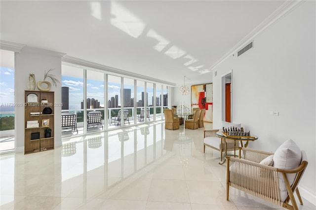 living area featuring visible vents, a city view, crown molding, tile patterned flooring, and a wall of windows