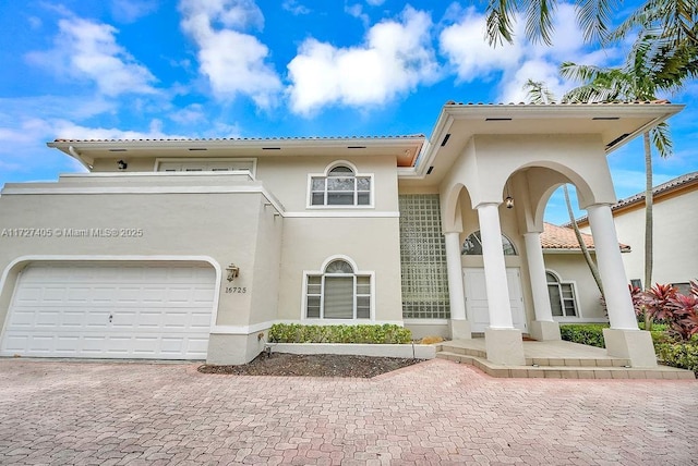 mediterranean / spanish-style house featuring a garage