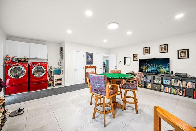 rec room with light tile patterned flooring and separate washer and dryer