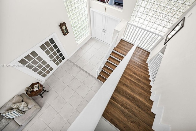 stairs featuring hardwood / wood-style floors