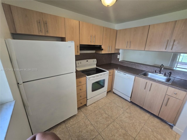 kitchen featuring light tile patterned floors, sink, light brown cabinets, and white appliances