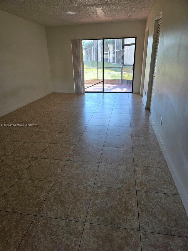 bathroom featuring toilet, vanity, and tile patterned flooring