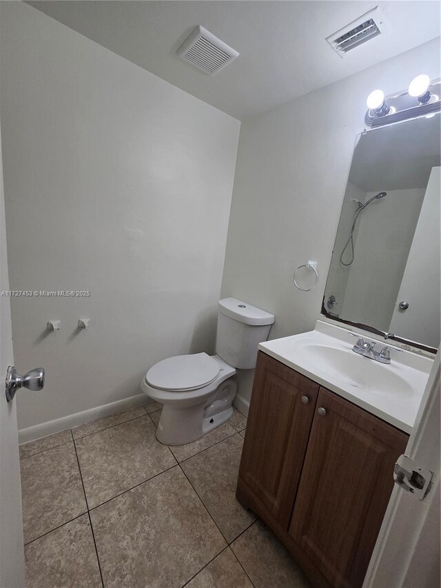 tiled empty room with a textured ceiling