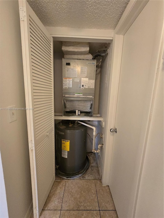 utility room featuring electric water heater