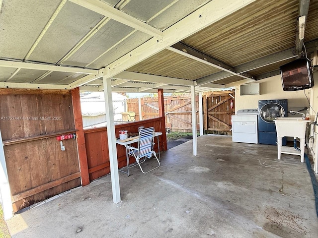 view of patio featuring sink and washer and dryer