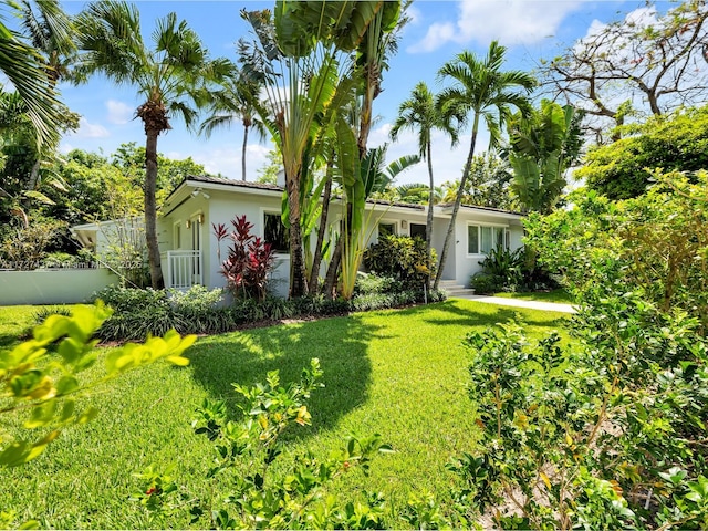 view of front of home with a front yard