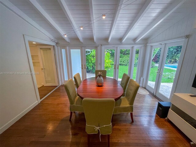 dining area with vaulted ceiling with beams, dark hardwood / wood-style flooring, and french doors