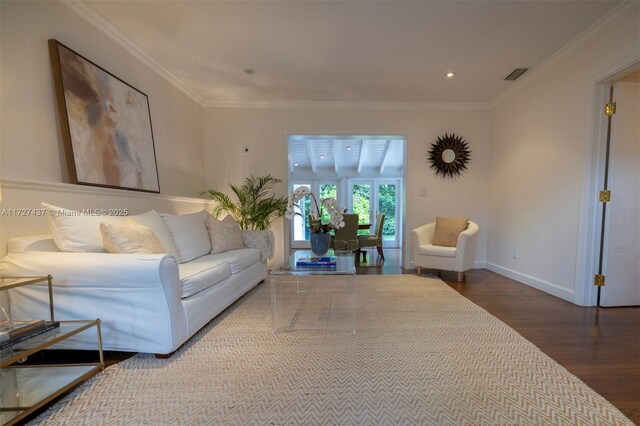 living room featuring ornamental molding and hardwood / wood-style floors